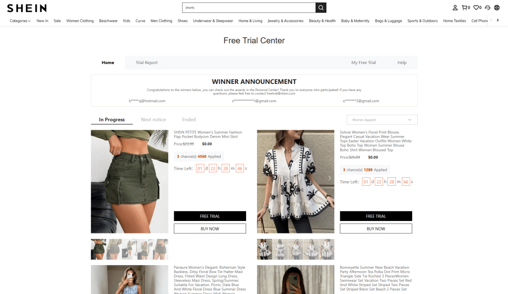 Screenshot of the SHEIN 'Free Trial Center' webpage. The header includes the categories menu and a search bar. Below, a 'Winner Announcement' banner displays partial email addresses of winners. The main 'In Progress' section features two items: on the left, a SHEIN PETITE olive green denim cargo mini skirt; on the right, a Solivie floral print white and black blouse. Both products show the original price crossed out, a current price of $0.00, the number of users who applied, a countdown timer, and buttons for 'Free Trial' and 'Buy Now'.